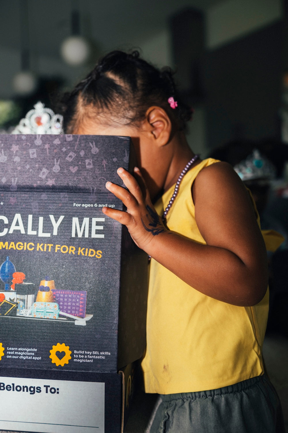 Child with a personalized Magically Me box